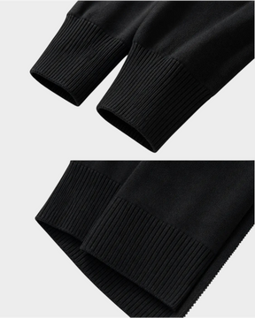 Detalhe dos punhos canelados pretos do Cardigan Habitat Bellagio em algodão com elastano